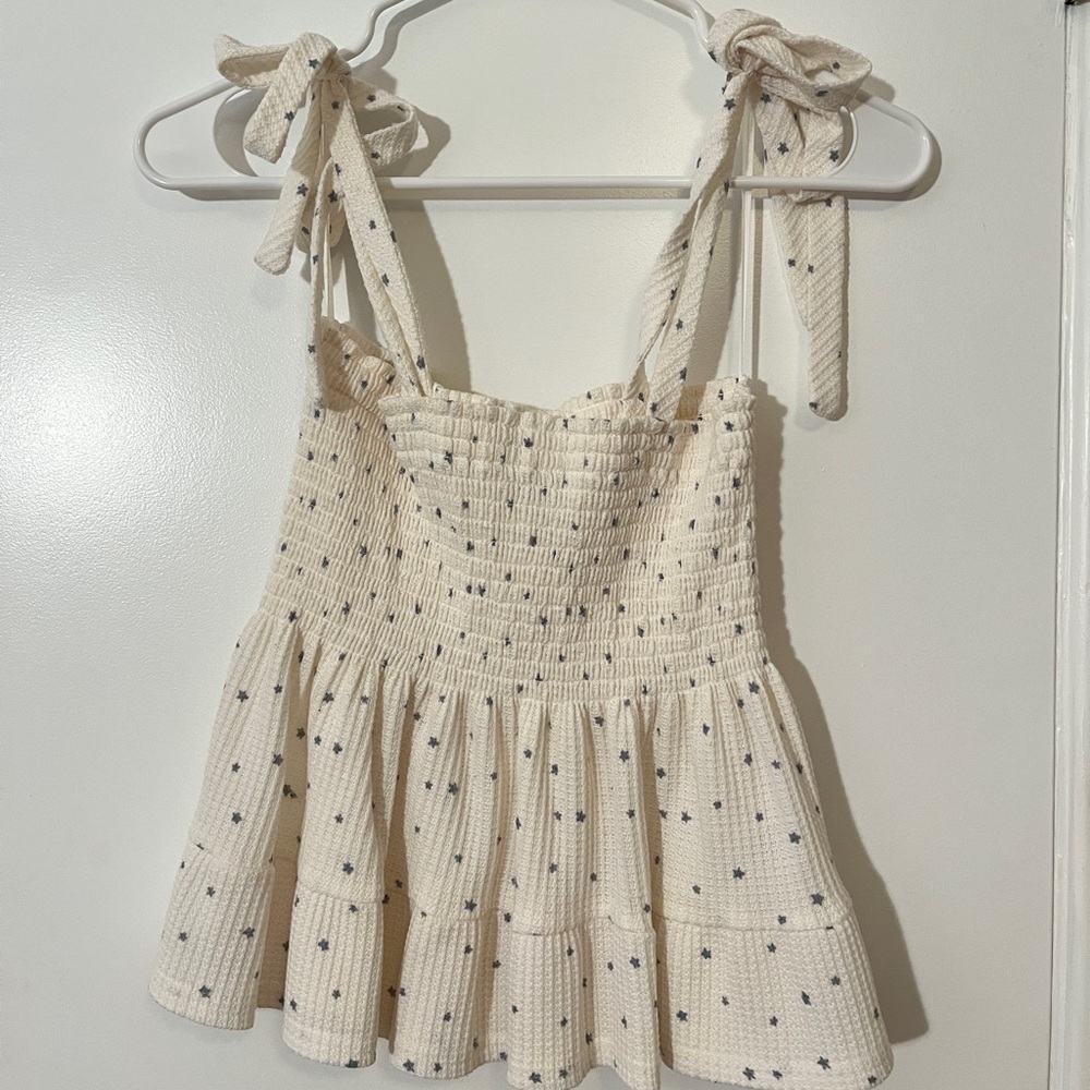 White/Cream Flowy Top with bows and star design.